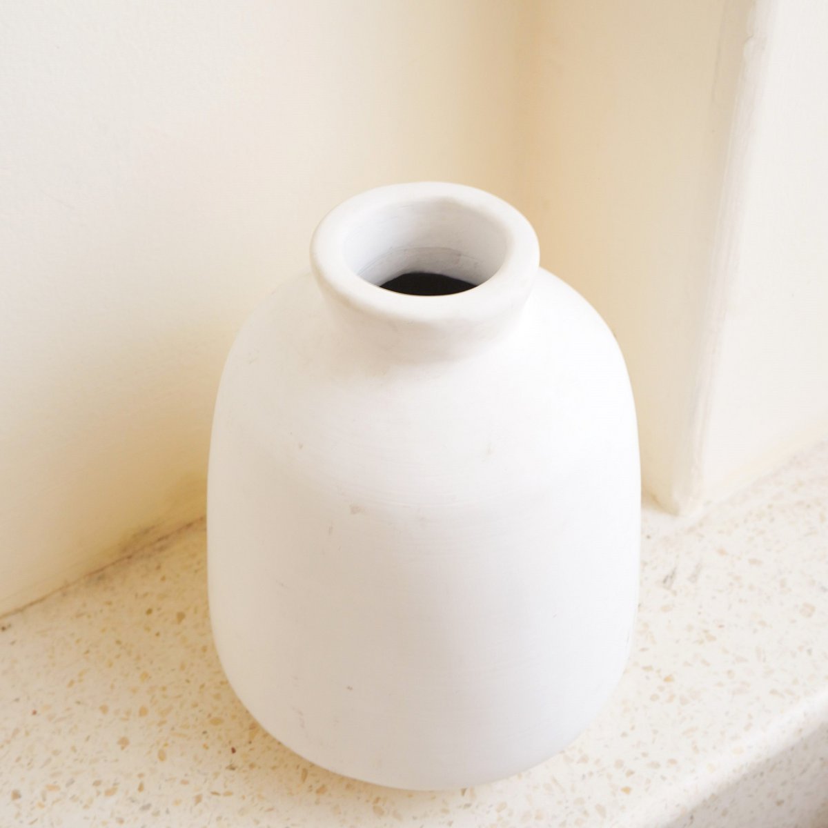 CozyVibe Bawa white clay vase styled in cozy home décor