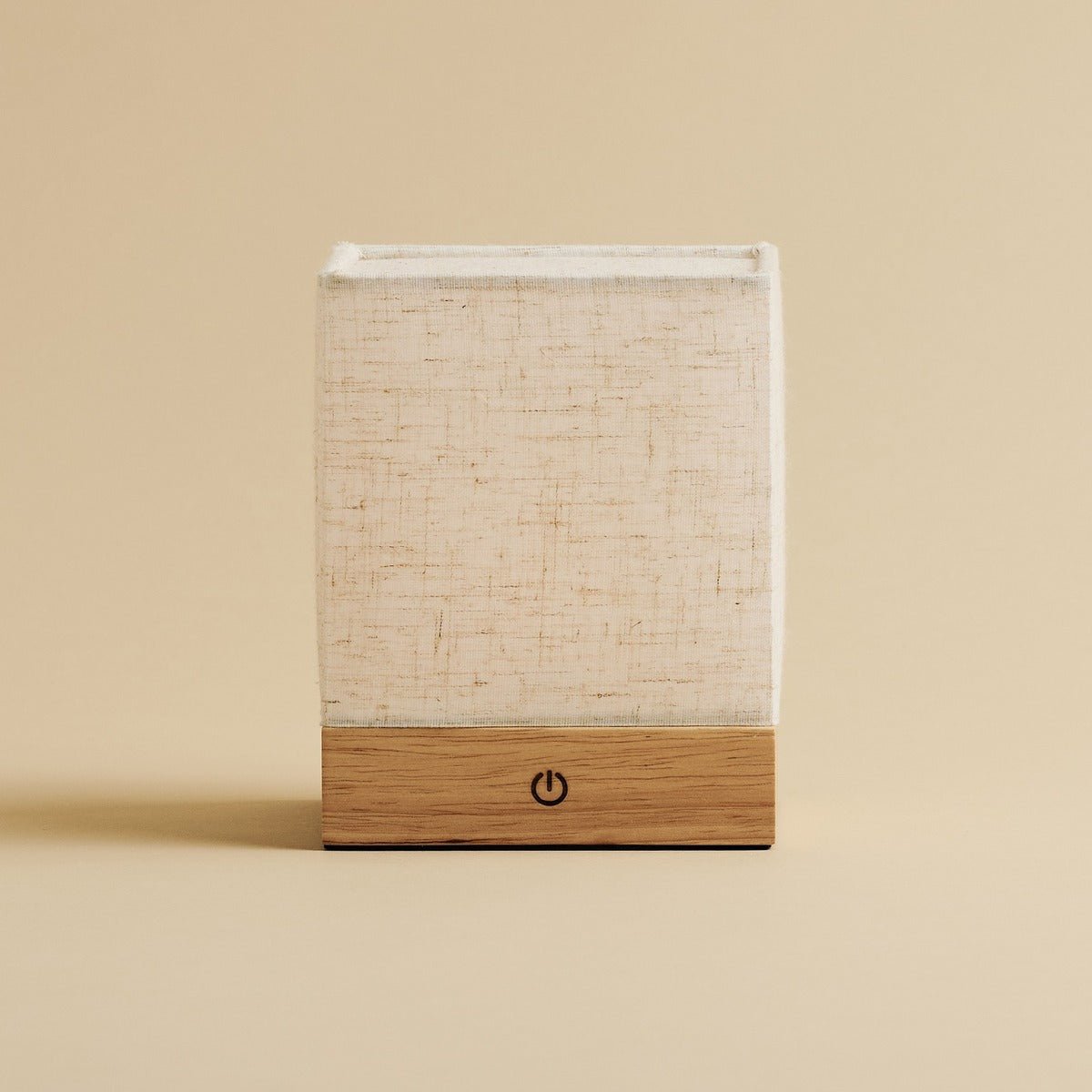 Natural-style table lamp with wooden base and linen shade, battery powered